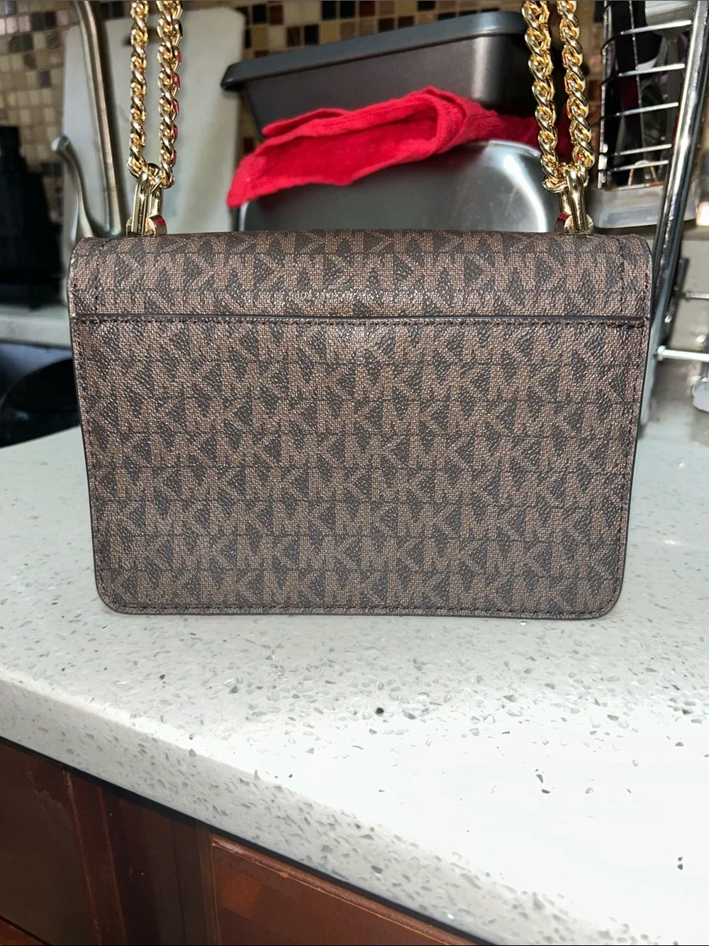 Like new Michael Kors Brown Logo Crossbody with Tan Leather and Gold Chain